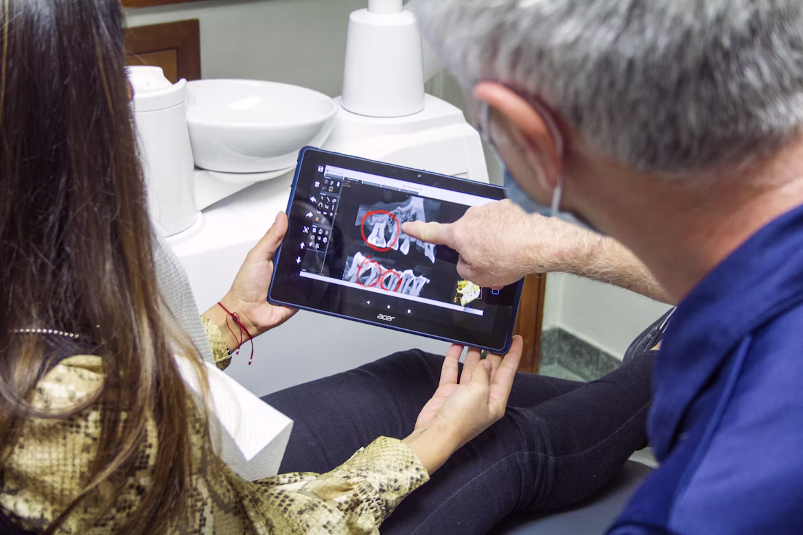 Dentist reviewing digital patient records